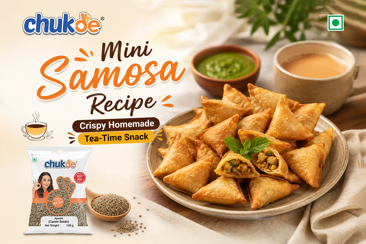 Crispy mini samosa served with green chutney on a plate